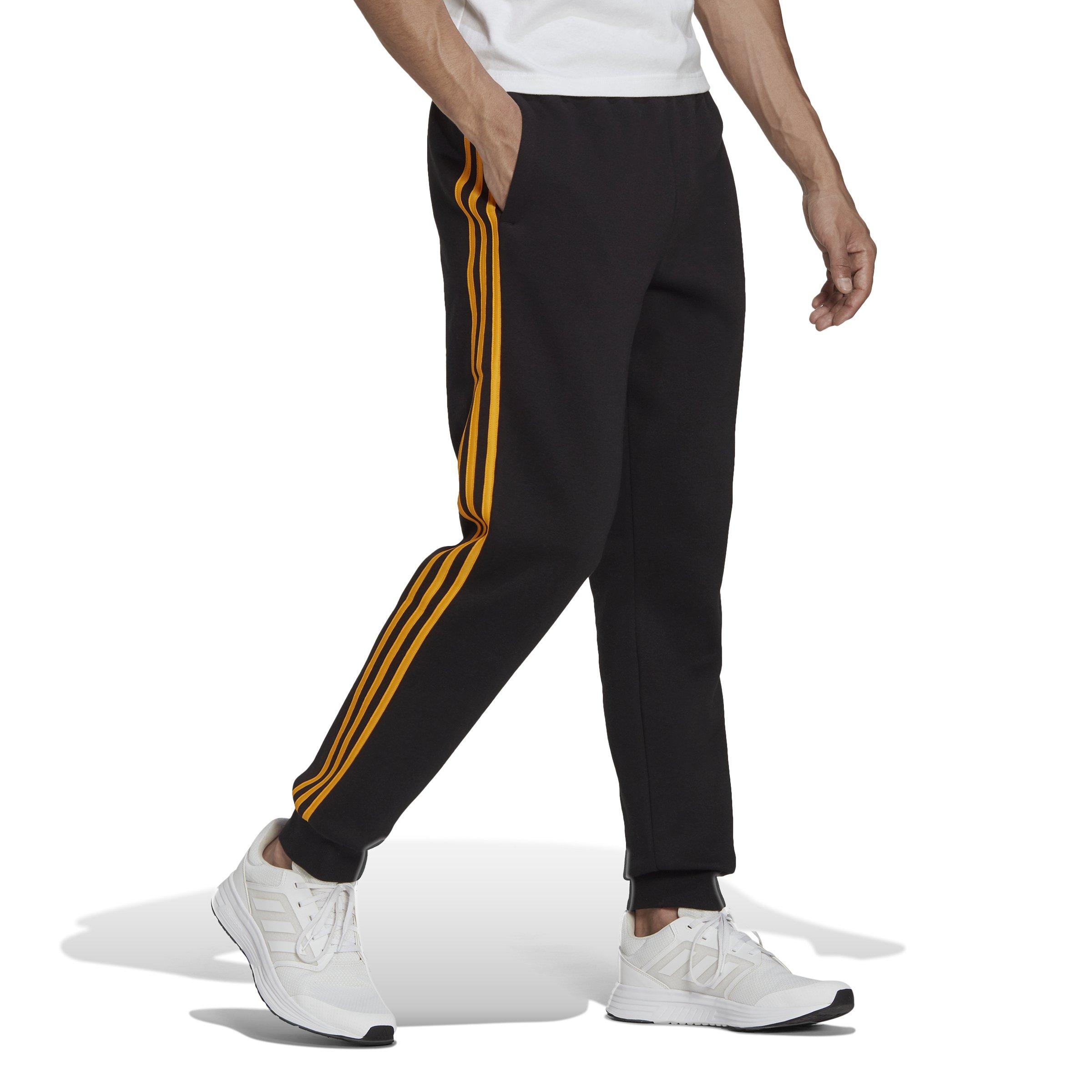 Adidas black 2025 and gold joggers